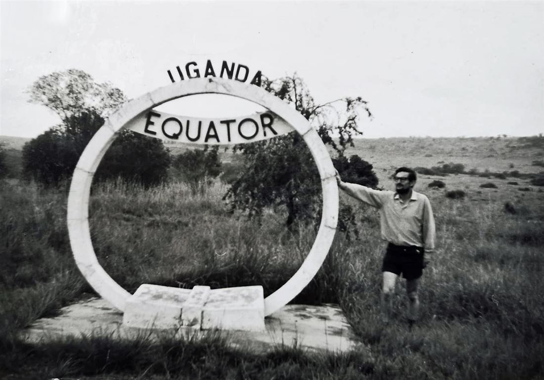 A young Brian Winder at the equator marker in Uganda